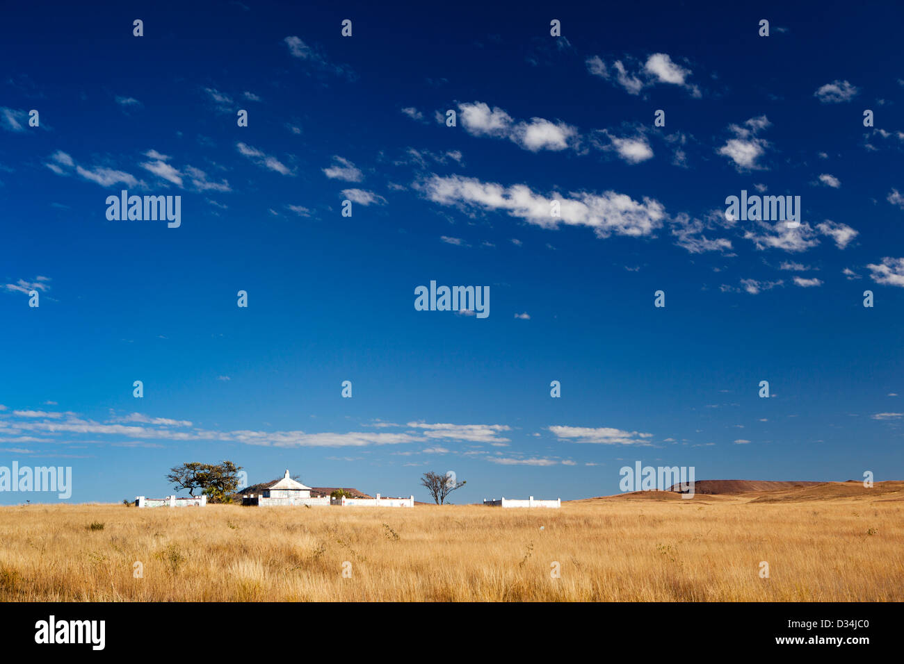 Madagascar, Ilakaka, large family tombs on horizon Stock Photo