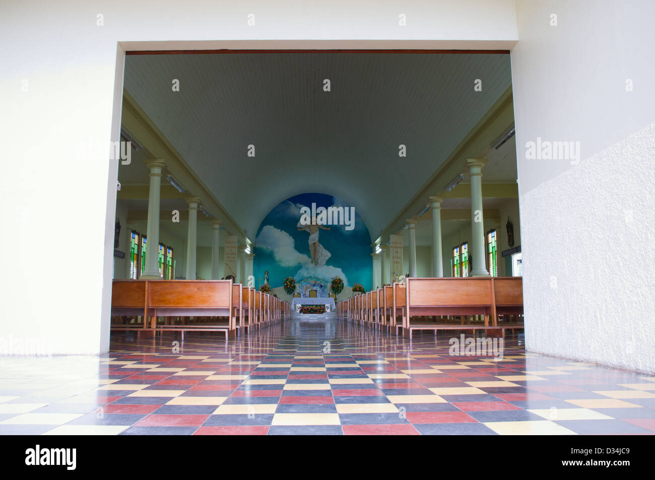center aisle seats and altar of catholic church at la fortuna costa