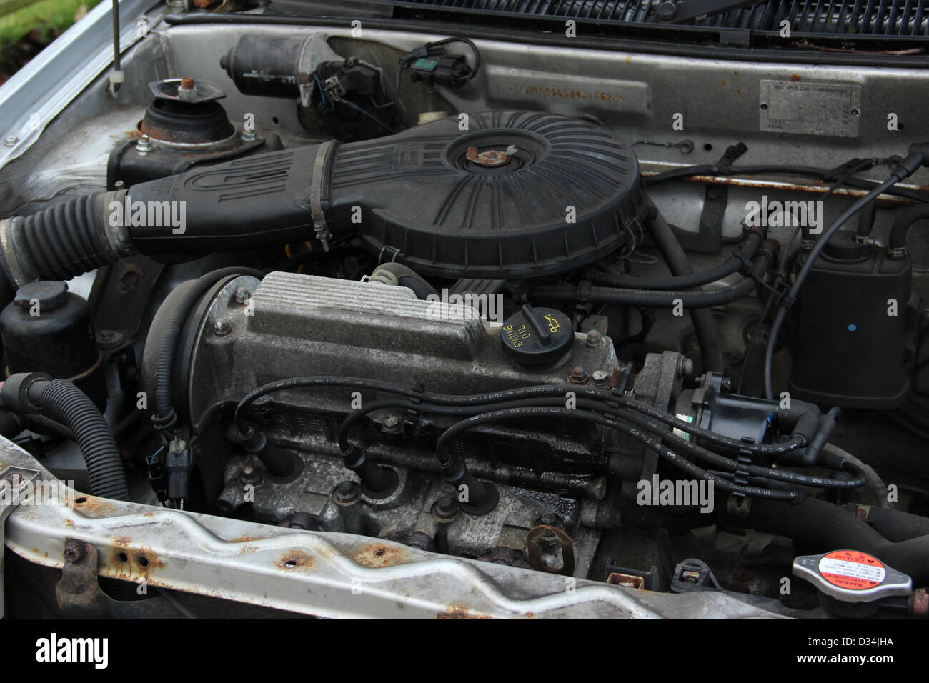 Engine of a 2002 Suzuki Swift car Stock Photo Alamy