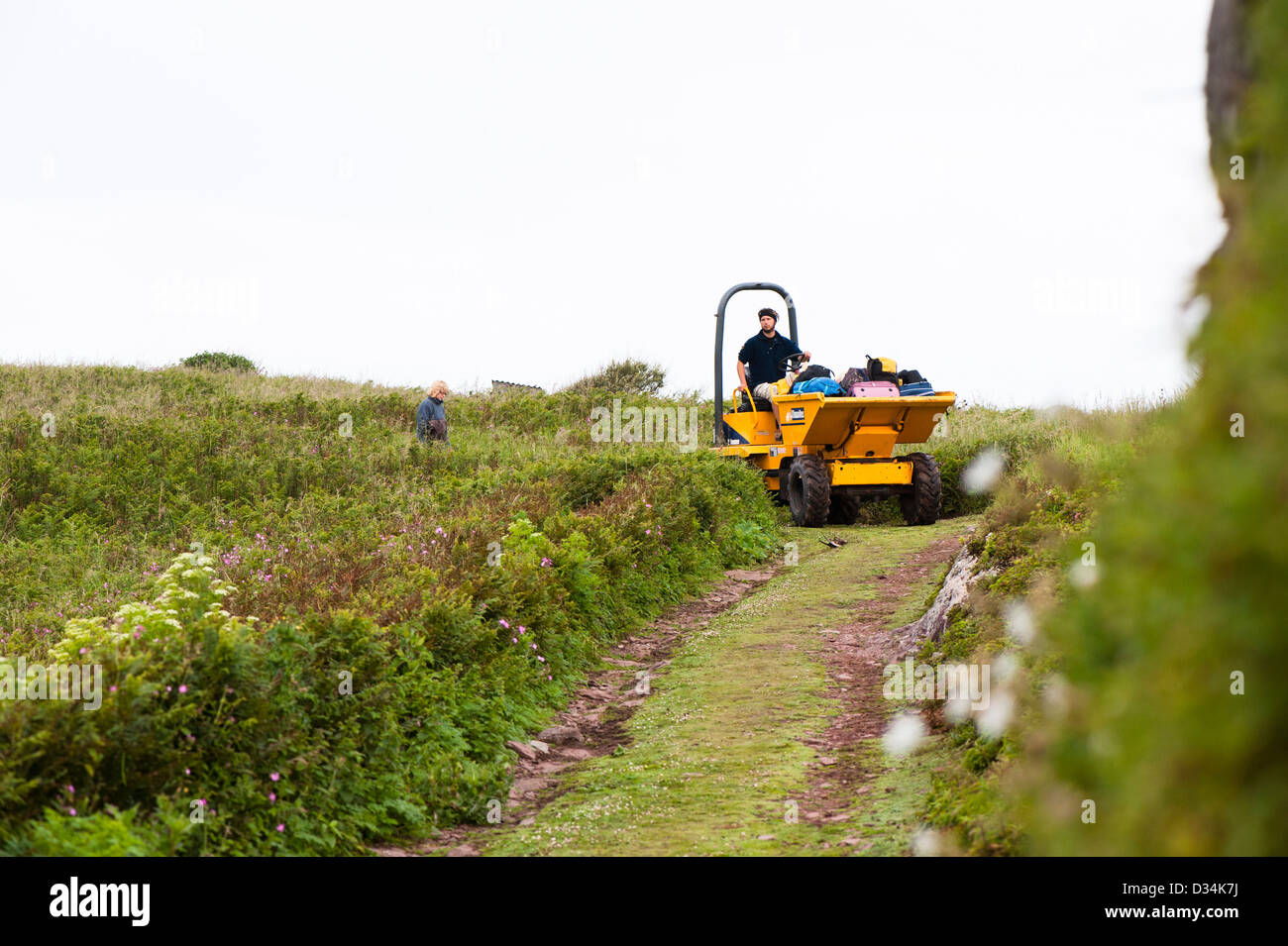 Warden transporting luggage to the landing, Skokholm Island, South Pembrokeshire, Wales, United Kingdom Stock Photo