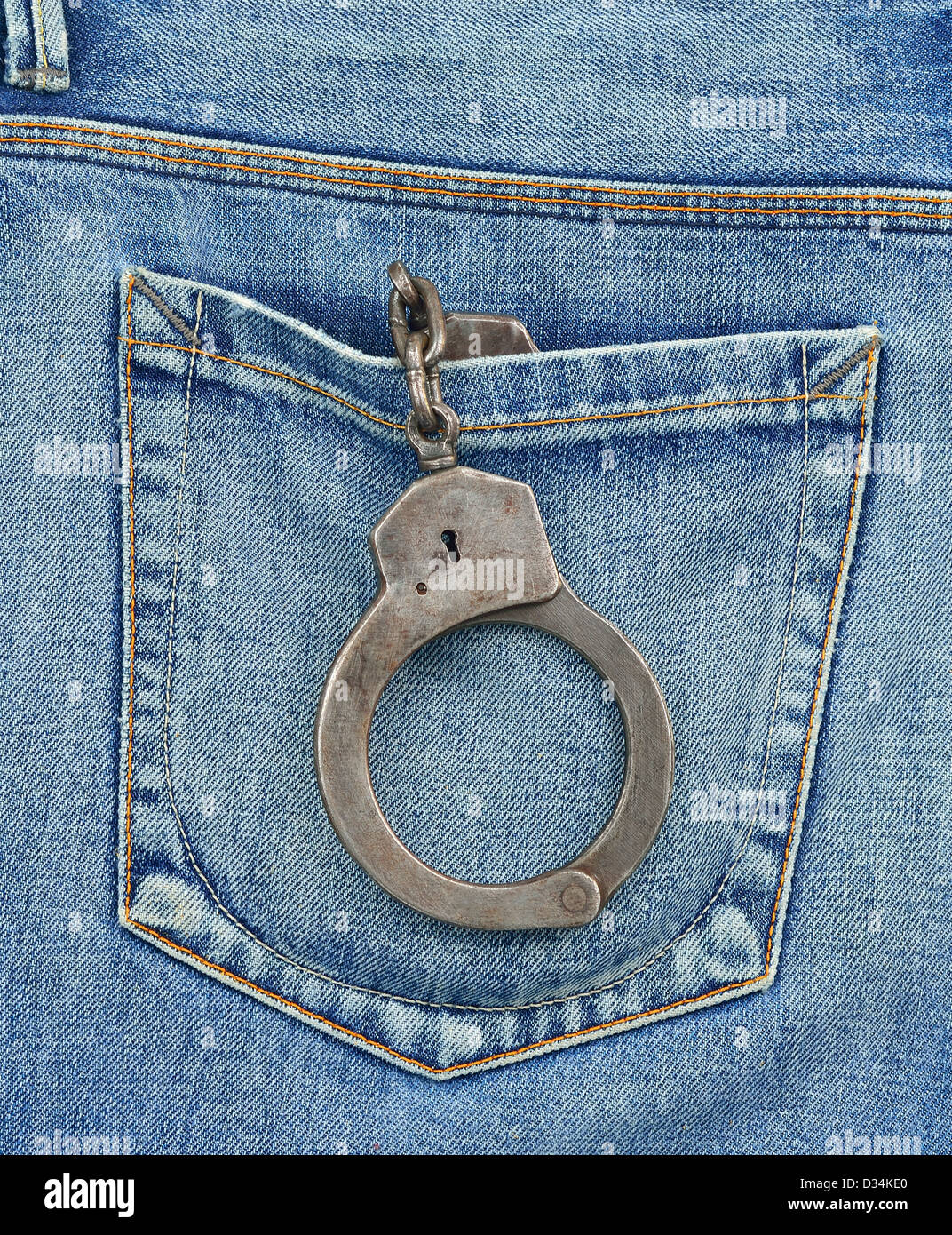 Back pocket of undercover police officer with handcuffs Stock Photo