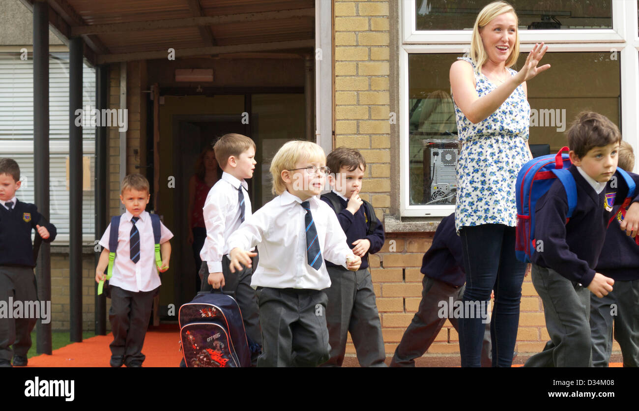 Junior Infant boys finishing their first day of school Stock Photo