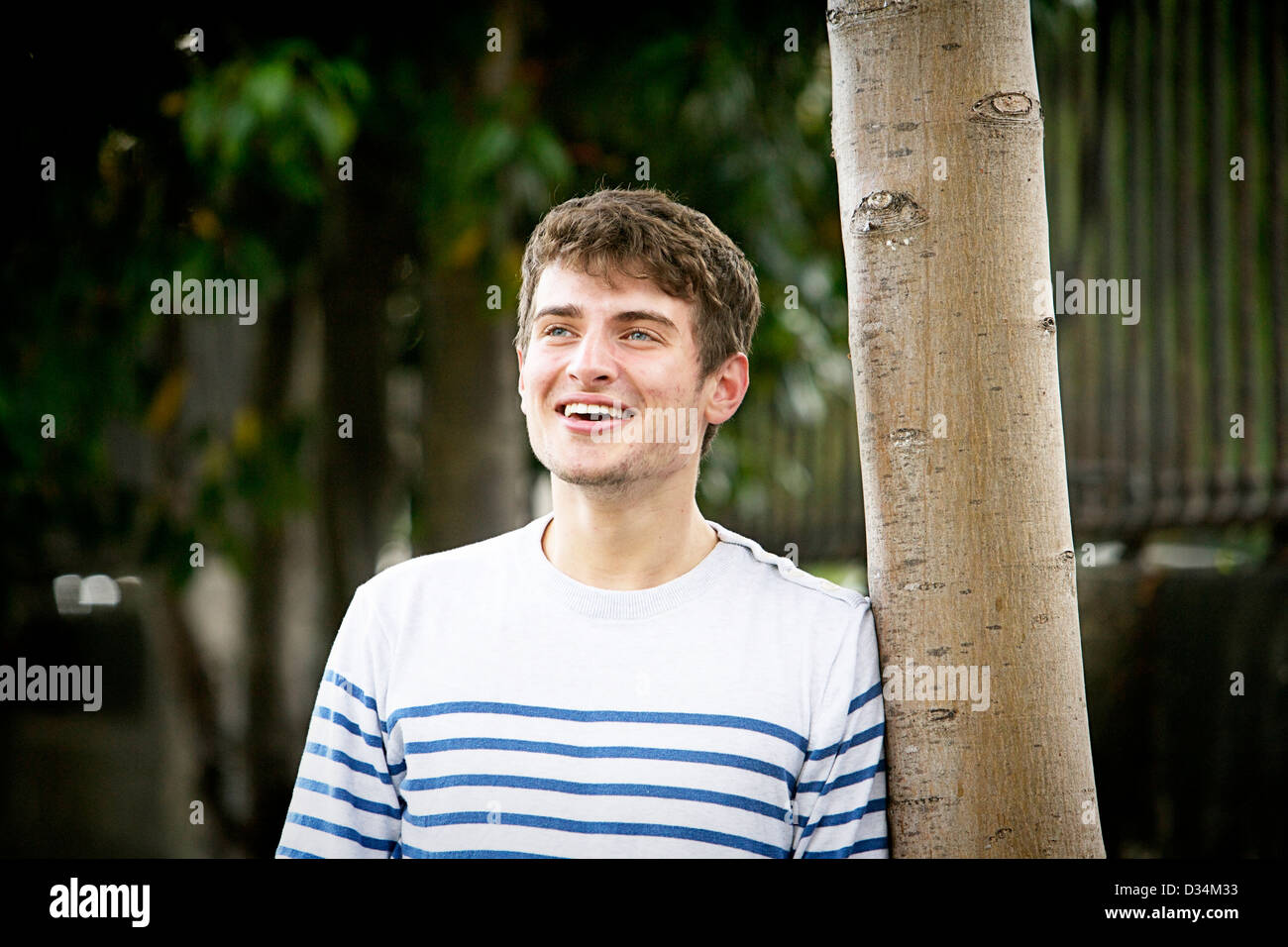 Young adult male standing Stock Photo
