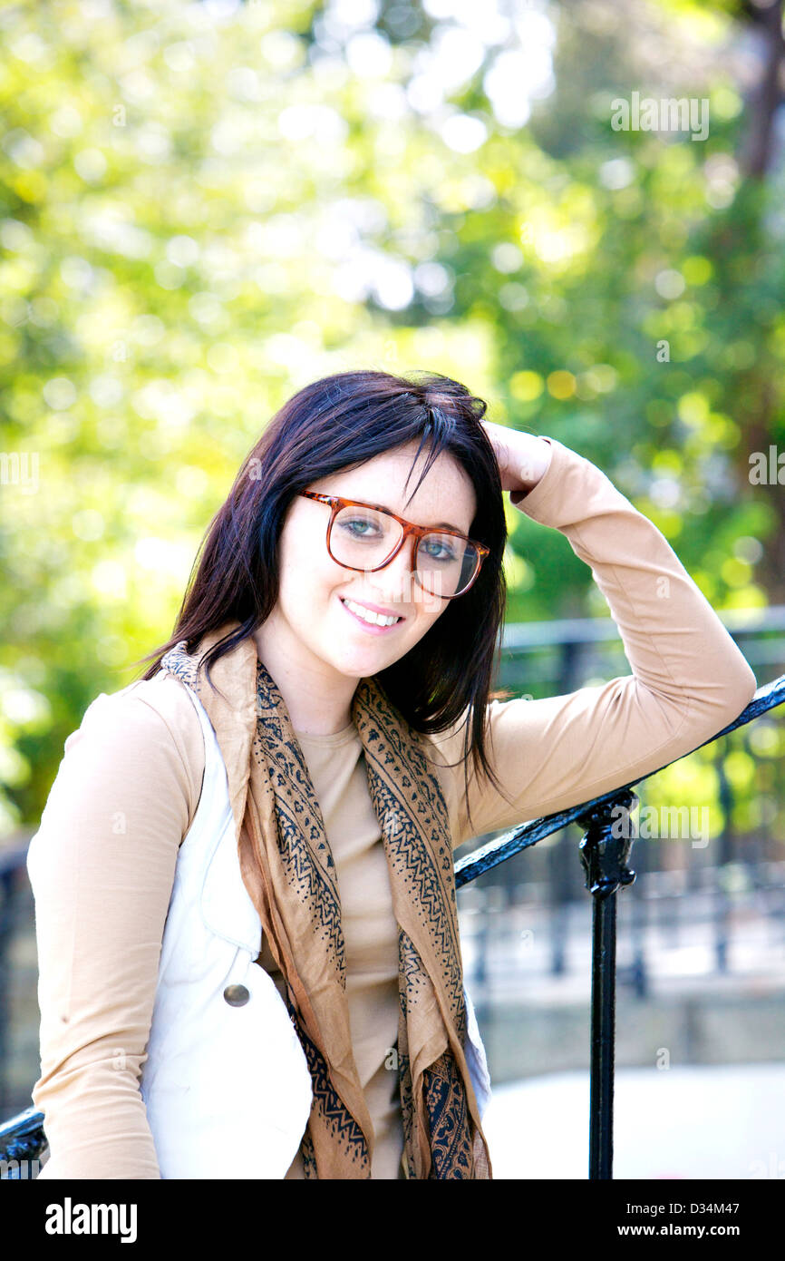 Young female adult brunette girl in an outside portrait Stock Photo