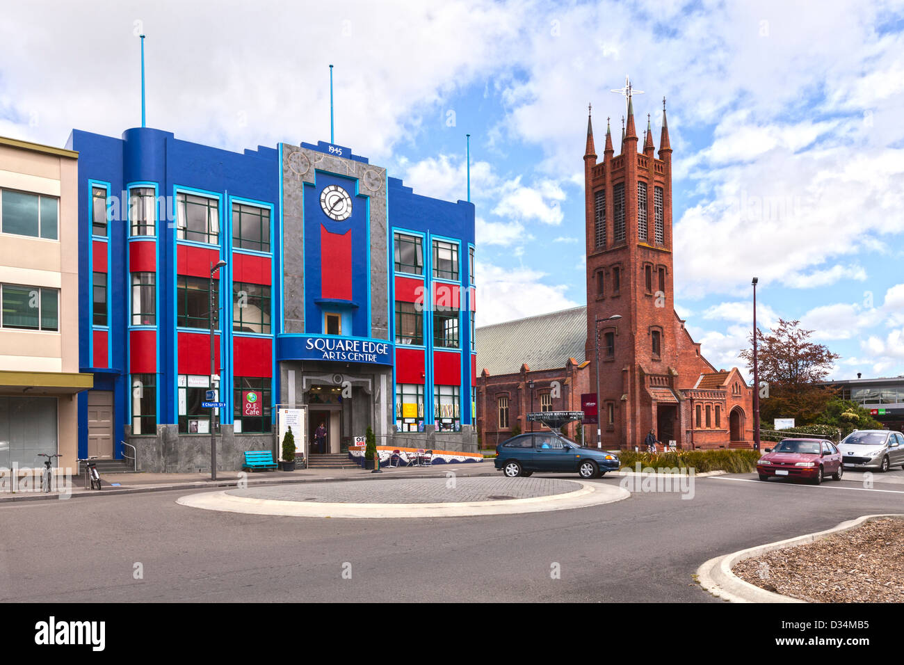 Square Edge Arts Centre, formerly the City Council Chambers, and All Saints Church in Palmerston North, Manawatu, New Zealand. Stock Photo