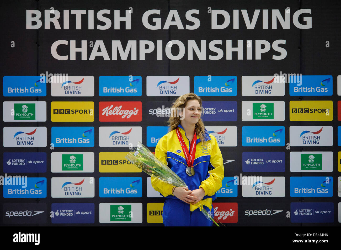 Plymouth, UK. 8th February 2013. Alicia Blagg (City of Leeds Diving Club) smiles on the podium with her medal after winning Womens 1m Springboard Final on Day 1 of the British Gas Diving Championships 2013 at Plymouth Life Centre. Credit:  Action Plus Sports Images / Alamy Live News Stock Photo