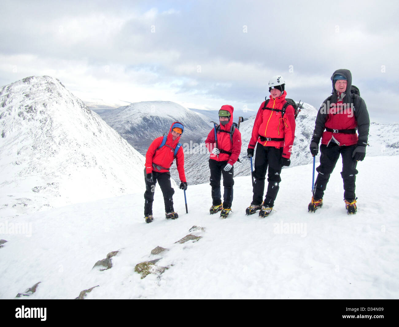 A group of winter mountaineers on the Scottish mountain Buachaille Etive Beag  in Glencoe  in Scottish highlands, Scotland UK Stock Photo