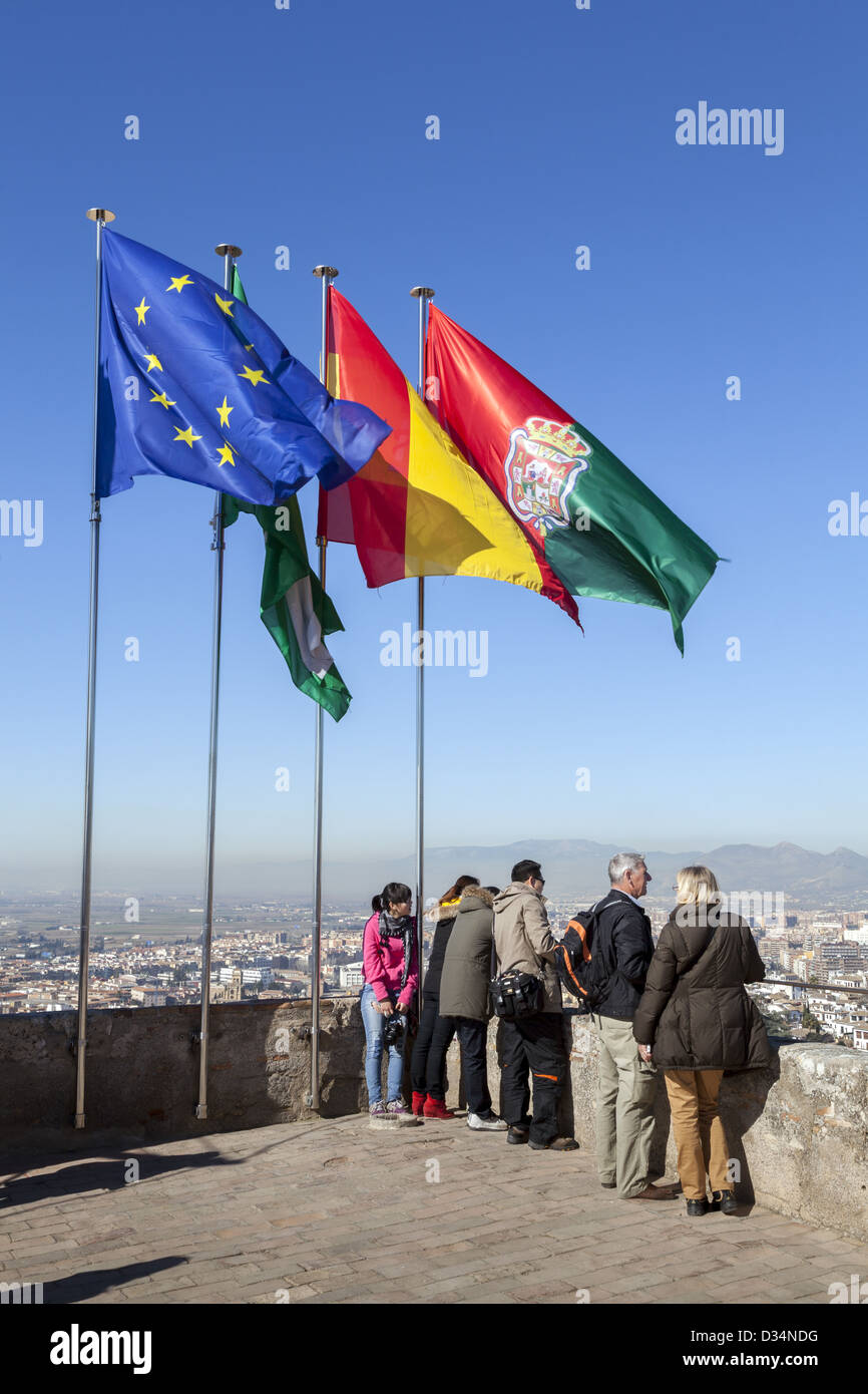 Flags of the European Union, Andalucia, Spain and Granada Torre de la Vela watchtower Alcazaba Alhambra Spain tourists Stock Photo