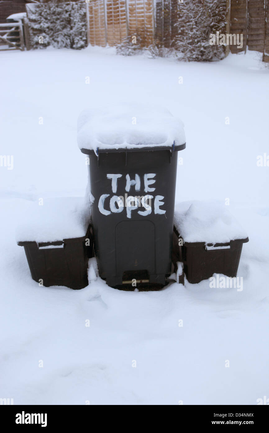 Waste and Recycling Bins out in the Snow Stock Photo