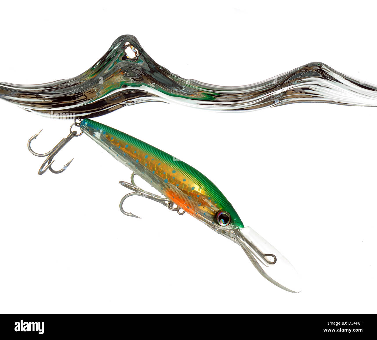 green and orange lure or fishing bait making a splash in water on white  background Stock Photo - Alamy