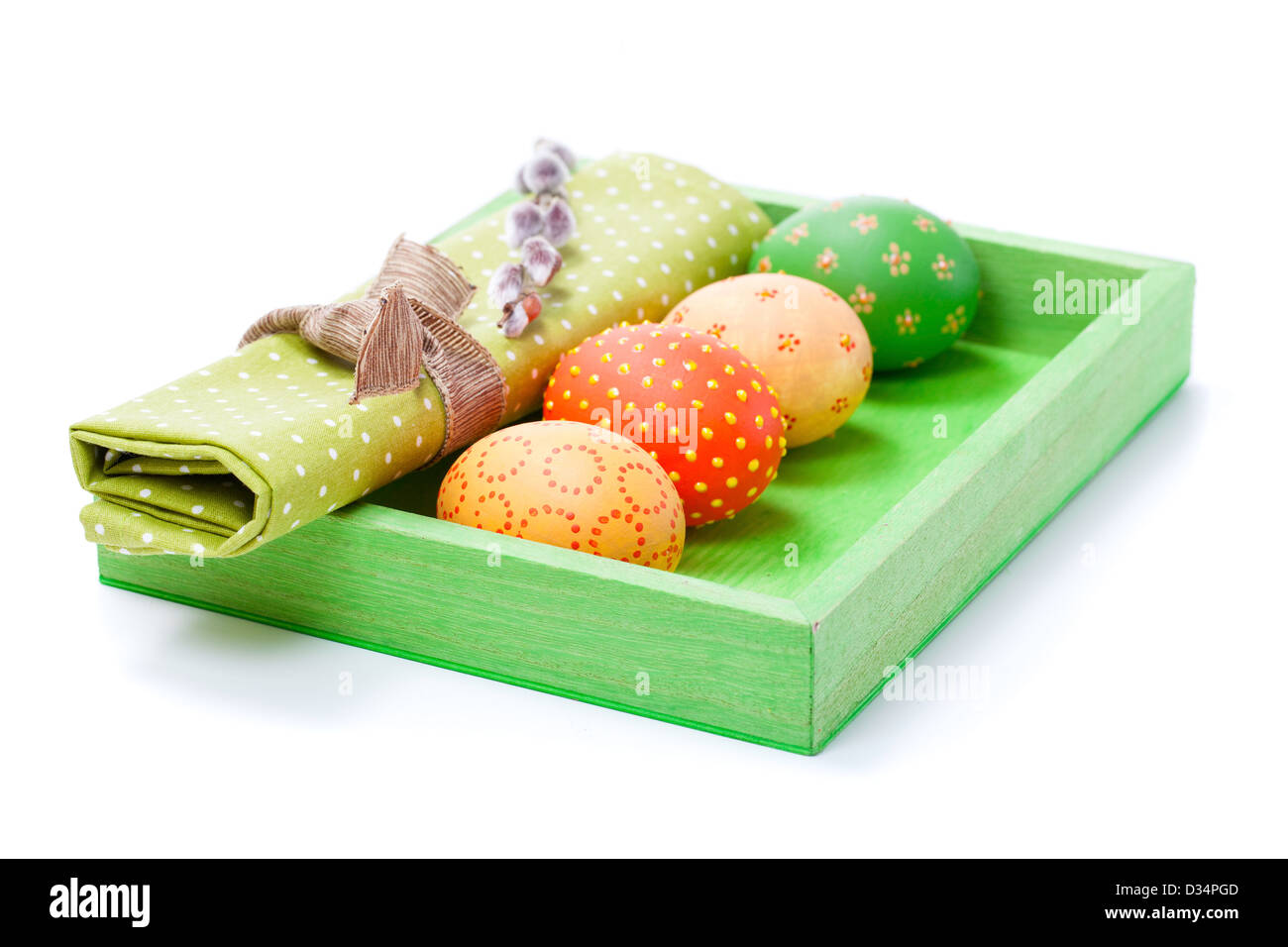 Easter egg with a serviette, in a tray for breakfast. isolated on white background. Stock Photo