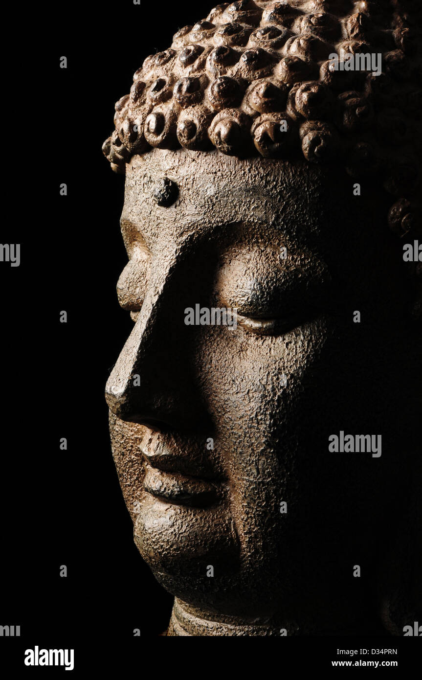 Buddha statue in meditation and prayer Stock Photo Alamy