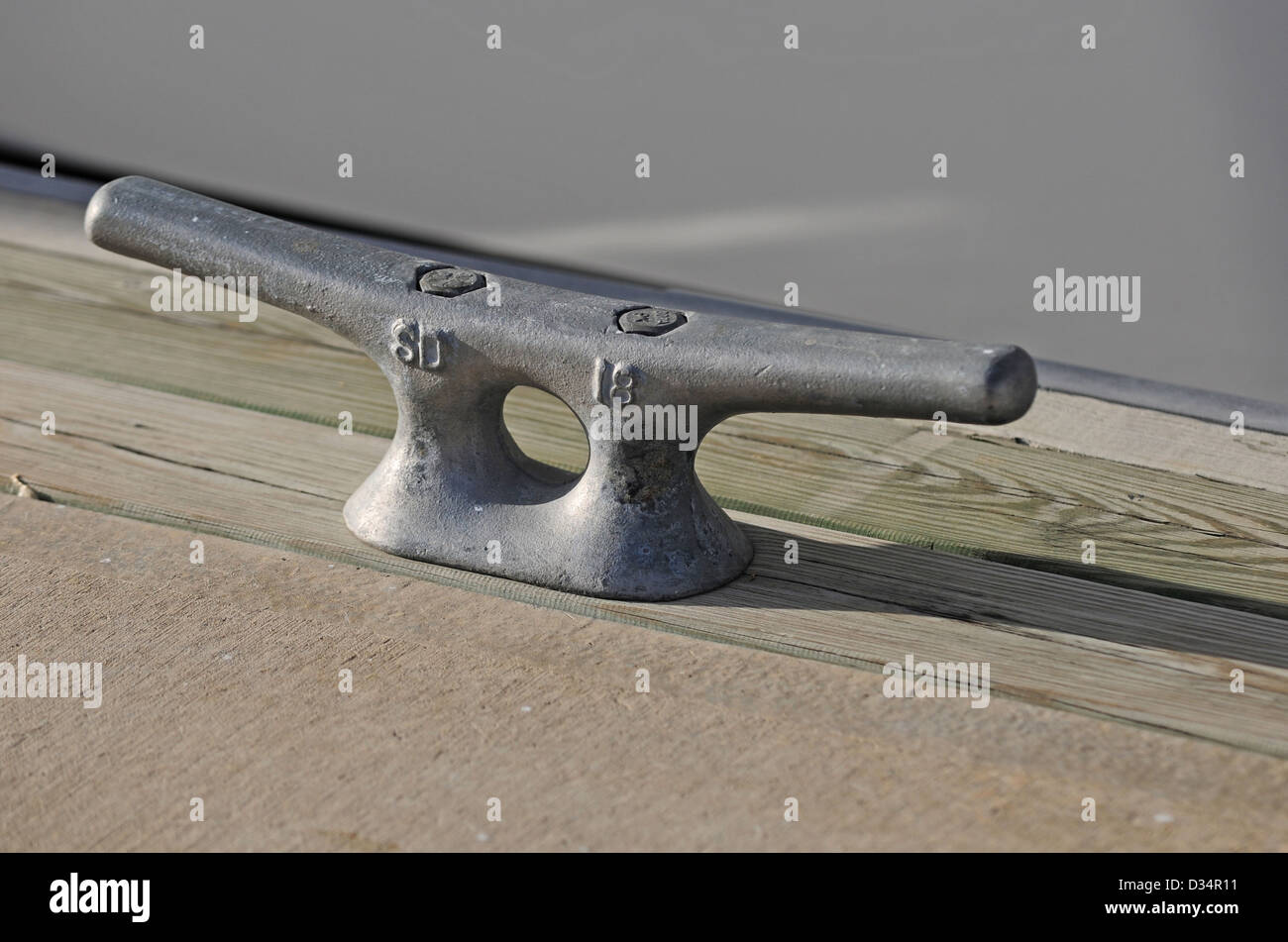 metal cleat on dock for tying a know Stock Photo Alamy