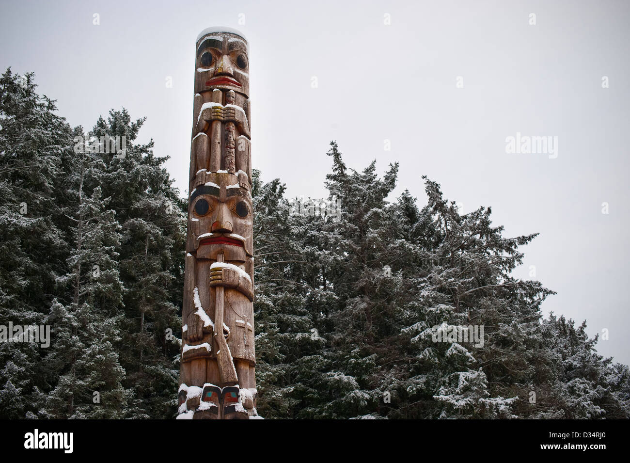 Winter scenic of totem pole in the Sitka National Historical Park, Sitka, Alaska, USA. Stock Photo