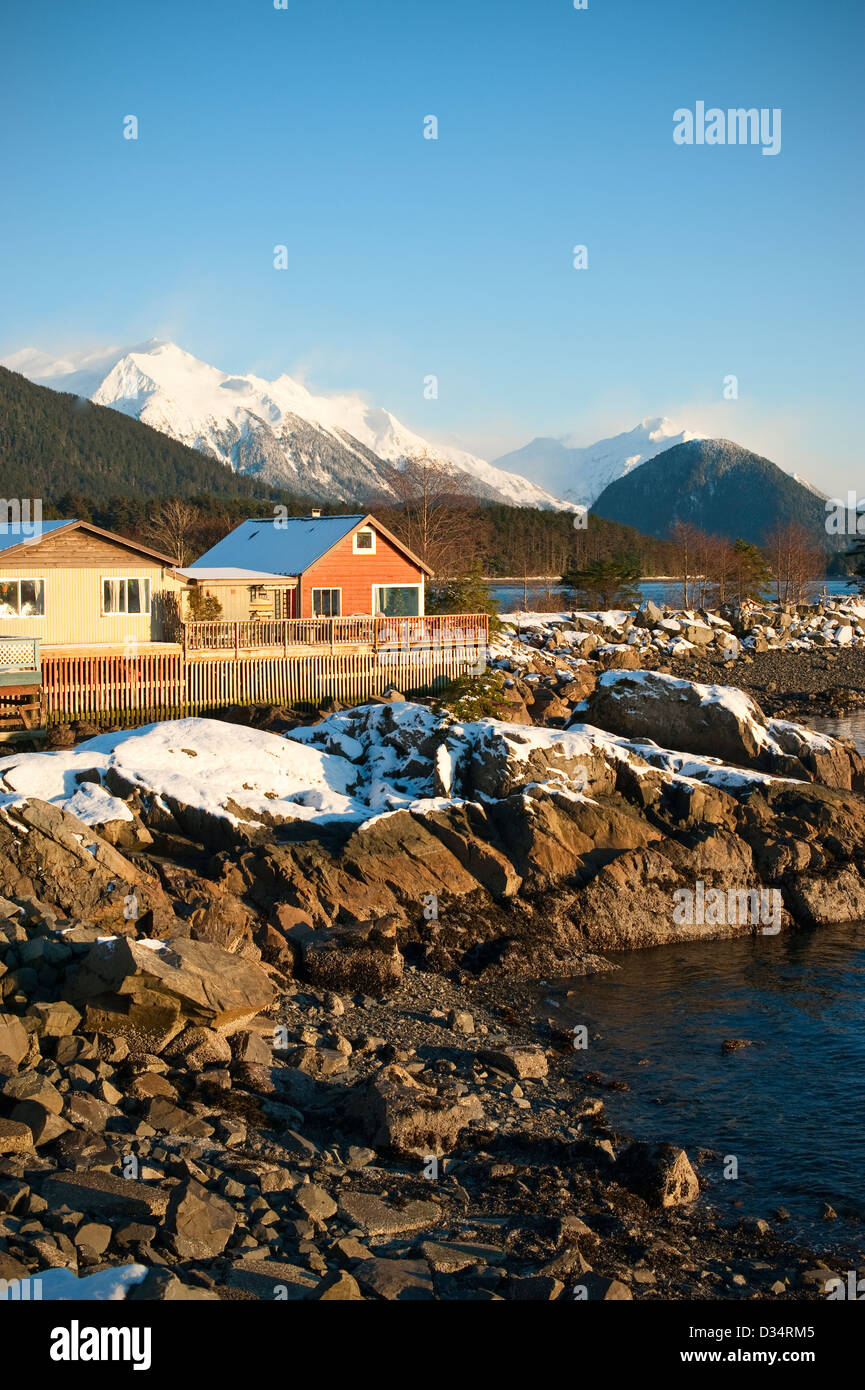 Scenic view of snow capped mountains and downtown Sitka, Alaska on a clear, cold winter's day. Stock Photo