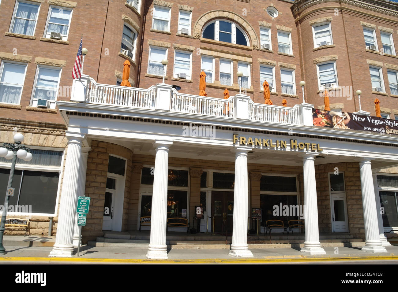 Sunny view white columns entrance brown bricks Franklin Hotel, Main