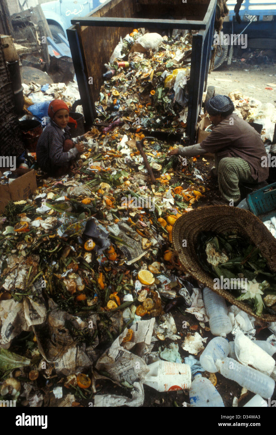 Rubbish pickers in an old part of Cairo, Egypt, look for things to recycle and sell Stock Photo