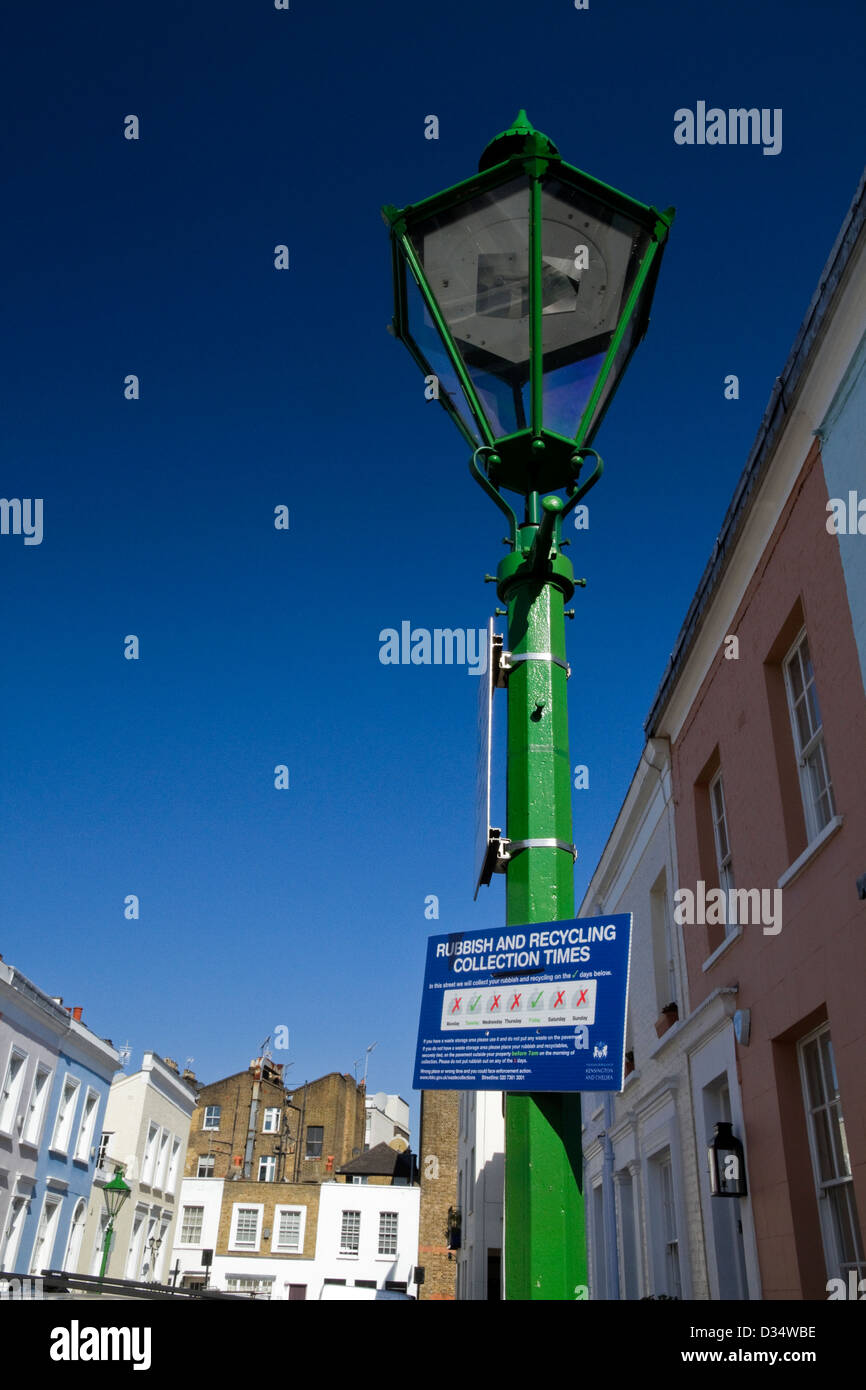 A street in Kensington and a notice from the Borough Council about refuse collection hanging on a lamp-post Stock Photo