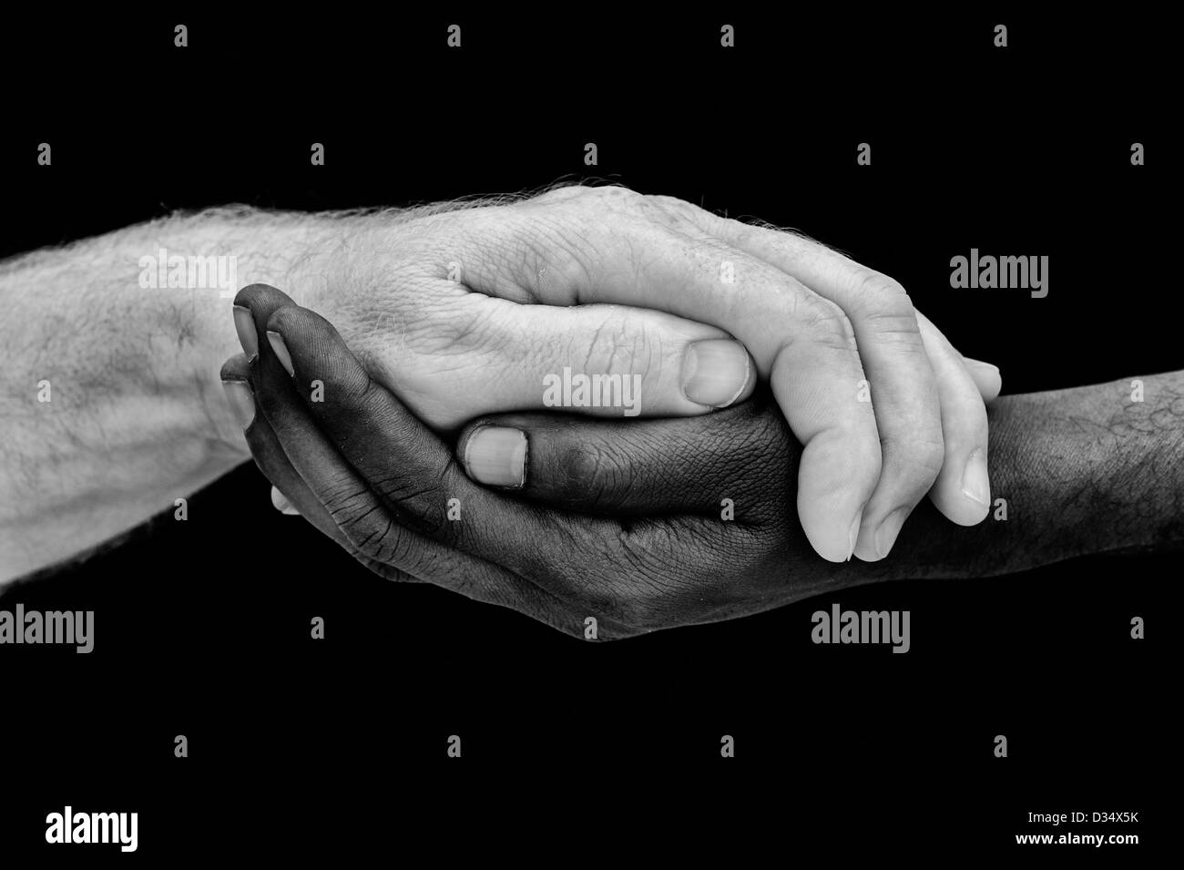Indian and English hands. Western and Eastern hands. Black and white. One humanity concept Stock Photo