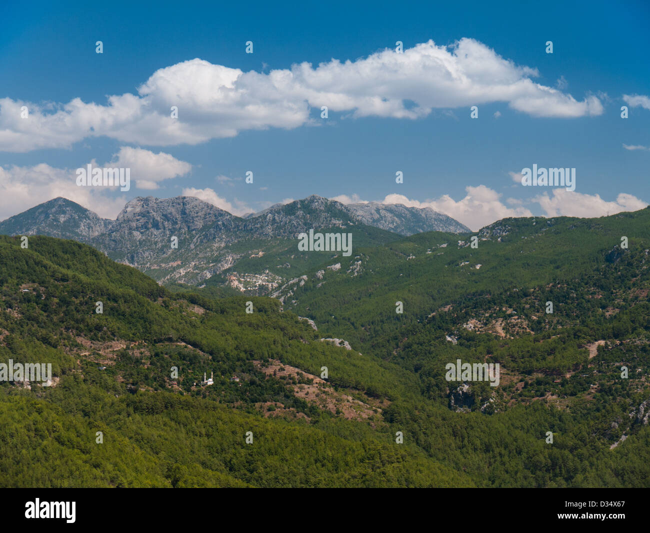 View of the Taurus mountains, Turkey, with remote mosque in the foreground. Stock Photo
