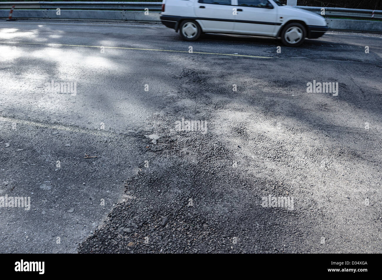 Damaged tarmac on road Stock Photo Alamy