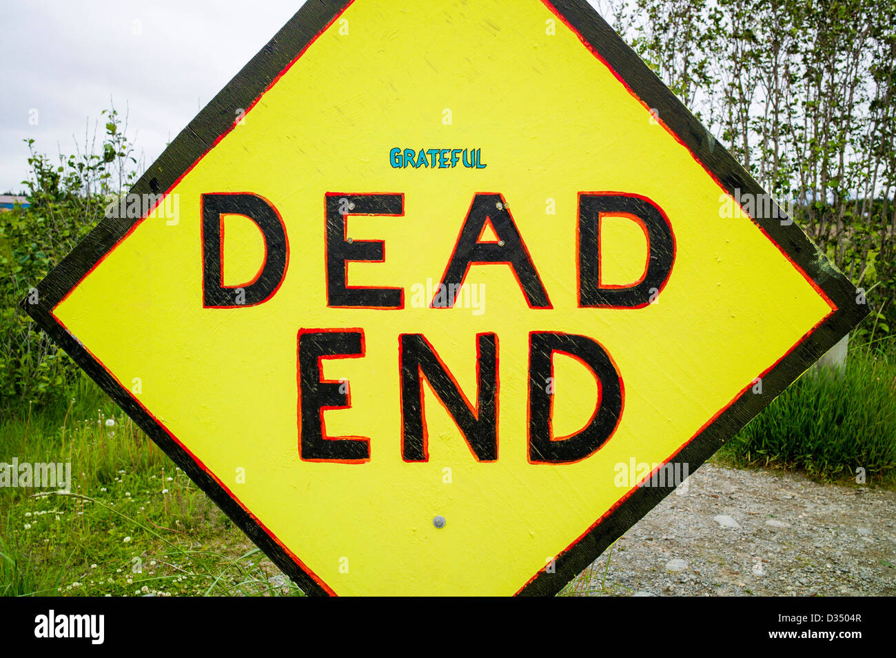 Humorous addition to road sign 'Grateful - Dead End', Homer, Alaska, USA Stock Photo
