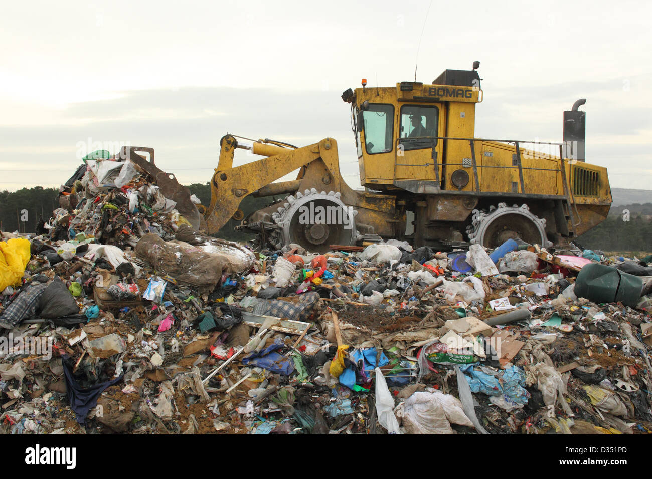 Tractor on landfill site , Dorset UK February Stock Photo