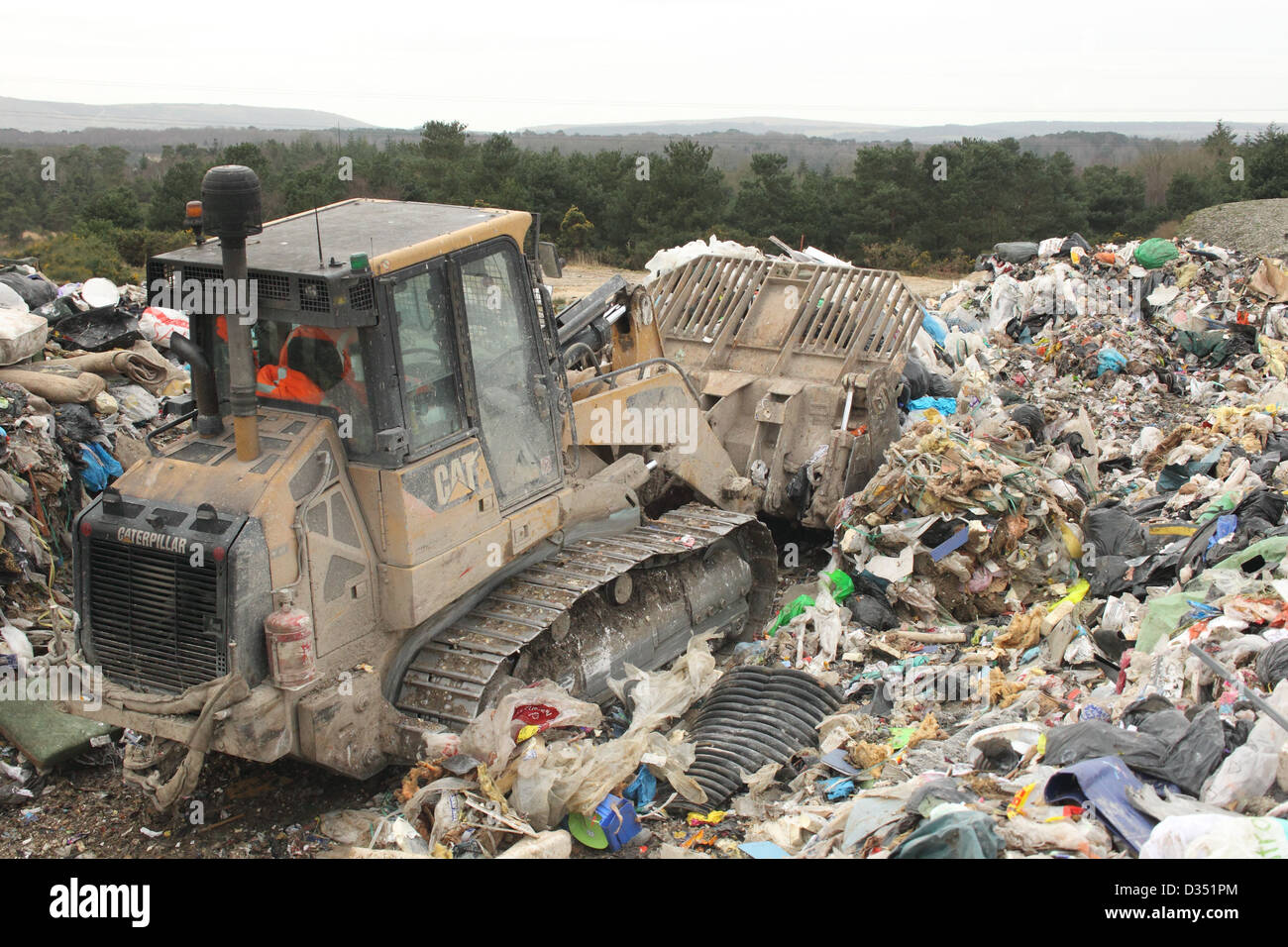 Bulldozer on landfill site, Dorset UK Febuary Stock Photo