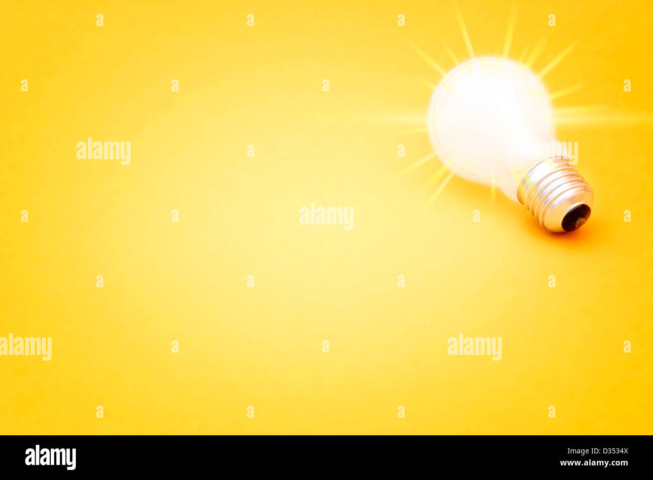 Background with lit lightbulb; Isolated on yellow Stock Photo - Alamy