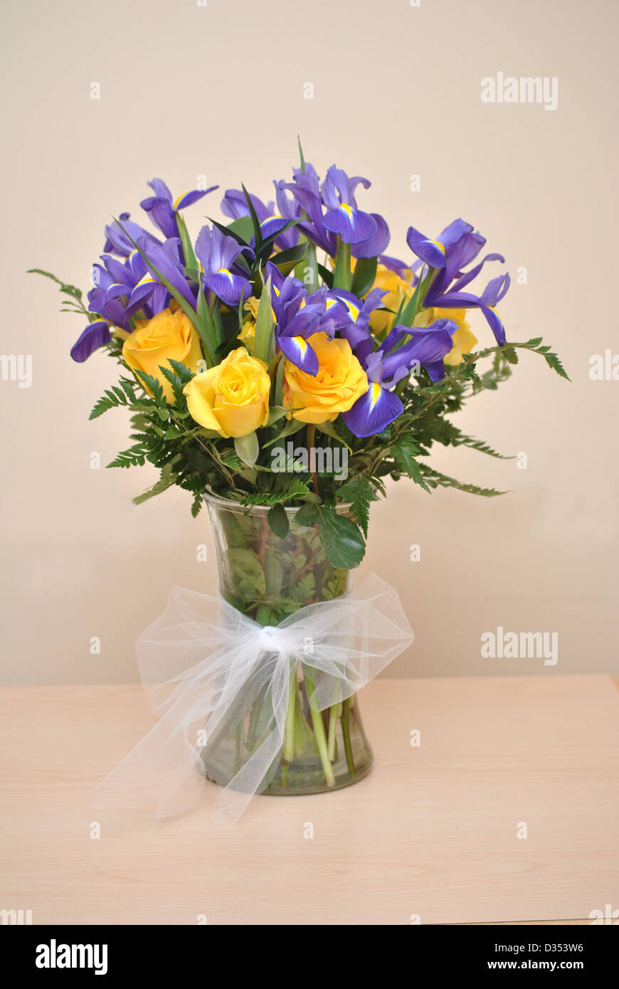 Vase of Yellow Roses and Purple Irises Stock Photo Alamy