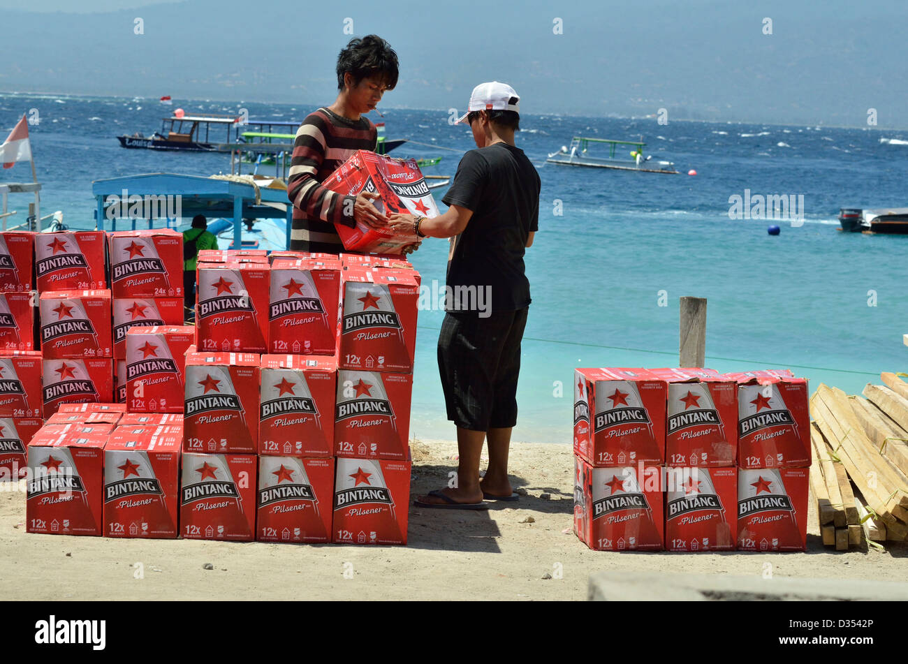 Offloading beer on a tropical beach at Gili Trawangan; Lombok, Indonesia. Stock Photo