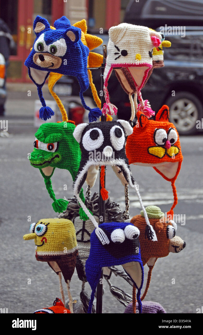 Silly animal winter hats with animal faces for sale on Broadway in Greenwich Village, New York City Stock Photo