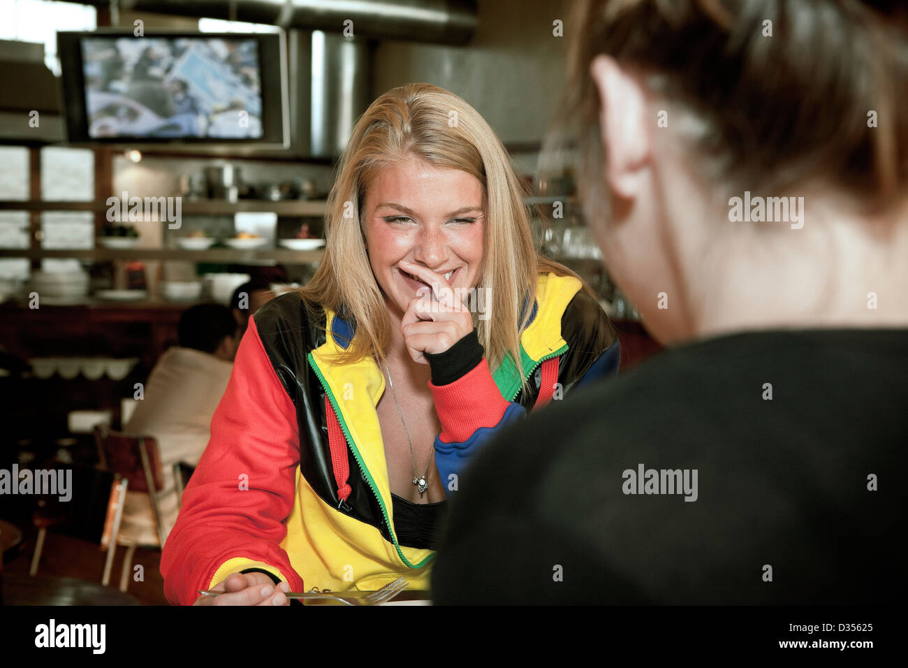 Two women sitting and socialising in a cafe on Long Street, the main entertainment hub of Cape Town Stock Photo