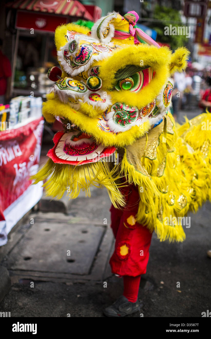 Feb. 10, 2013 - Bangkok, Thailand - Chinese Lion dance being performed on Chinese New Year on Yaowarat Road in the Chinatown section of Bangkok. Bangkok has a large Chinese emigrant population, most of whom settled in Thailand in the 18th and 19th centuries. Chinese, or Lunar, New Year is celebrated with fireworks and parades in Chinese communities throughout Thailand. The coming year will be the ''Year of the Snake'' in the Chinese zodiac. (Credit Image: © Jack Kurtz/ZUMAPRESS.com) Stock Photo