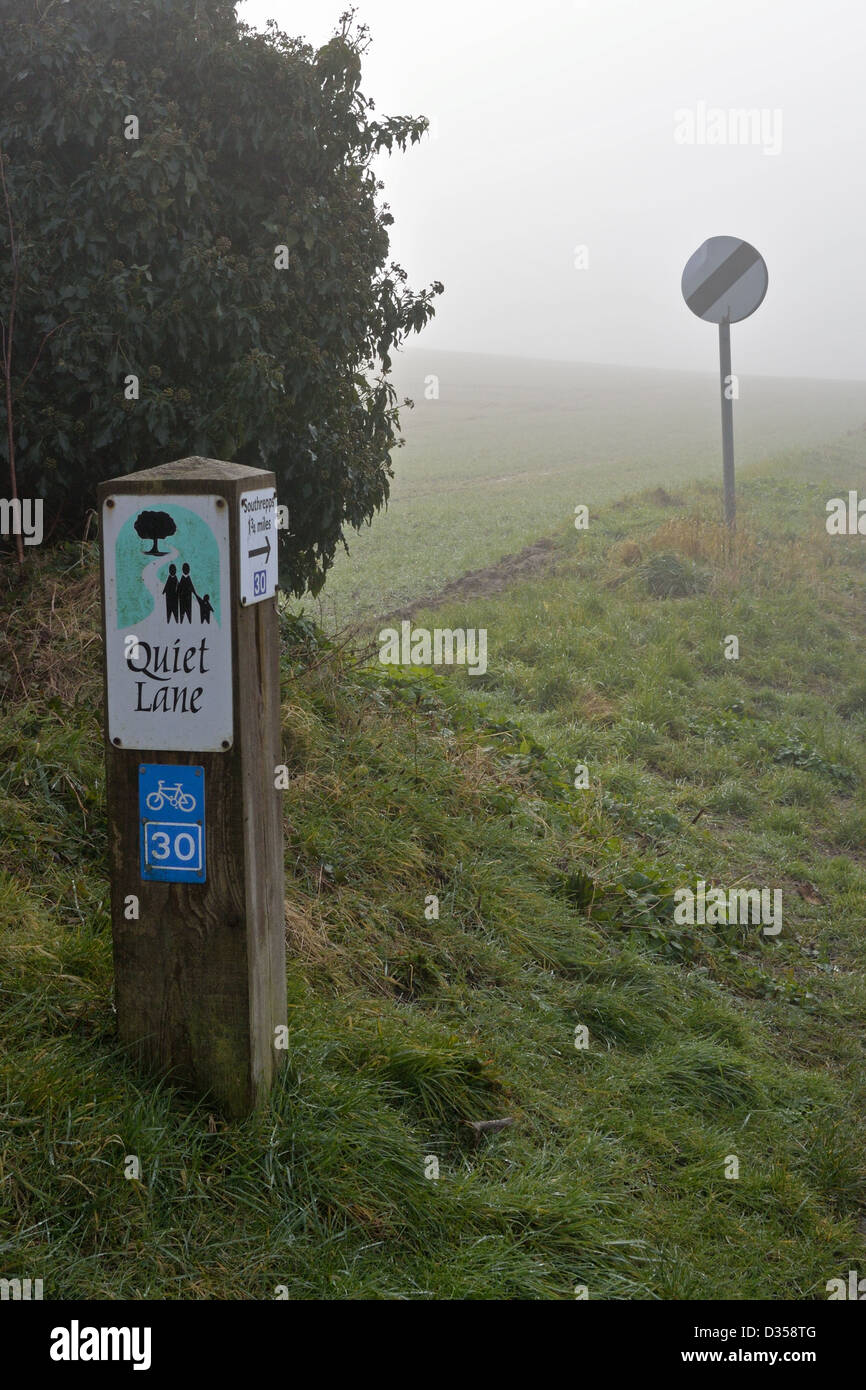 Quiet Lane and derestricted speed limit sign on road outside Northrepps, Norfolk, UKpedestrians Stock Photo
