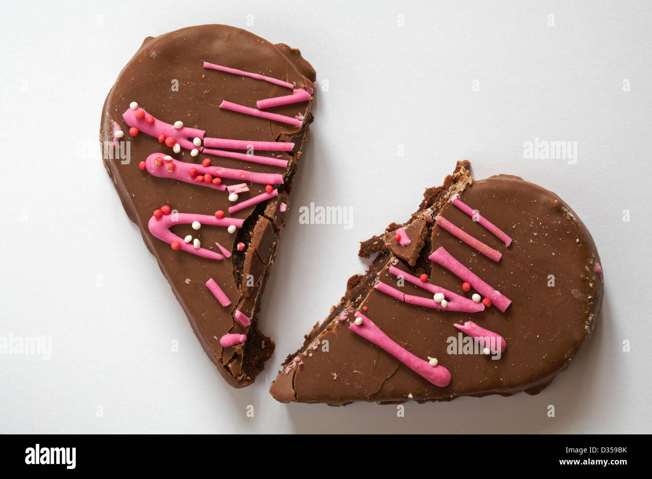 broken heart Valentine chocolate heart cake, heart shaped cake isolated on  white background - broken hearted concept on Valentine Day, Valentines Day  Stock Photo - Alamy