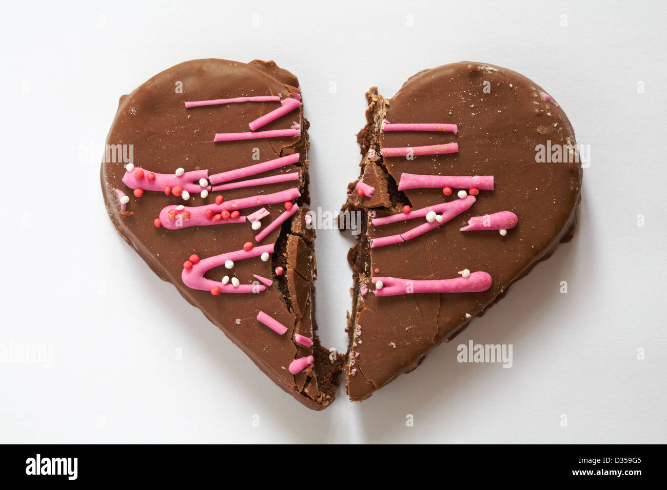 broken heart Valentine chocolate heart cake, heart shaped cake isolated on white background - broken hearted concept on Valentine Day, Valentines Day Stock Photo