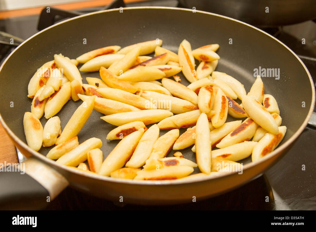 Potato noodles in a pan Stock Photo