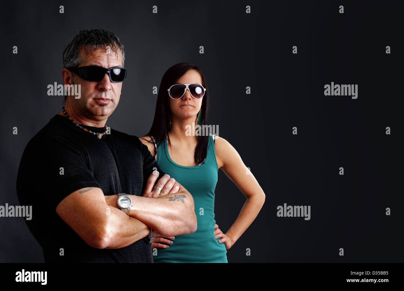 Tough guy with young biker chick Stock Photo