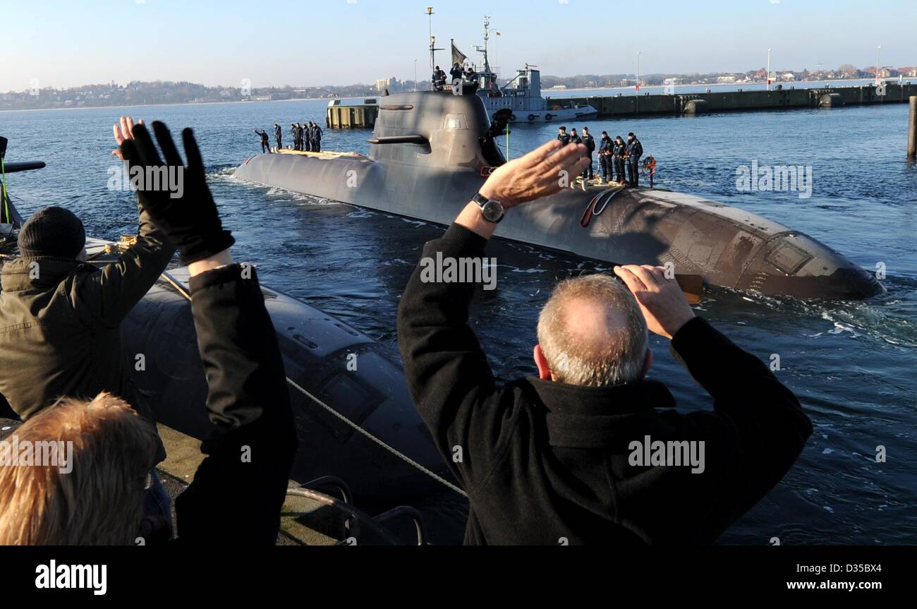 The German Navy's U32 submarine is given a farewell by relatives of