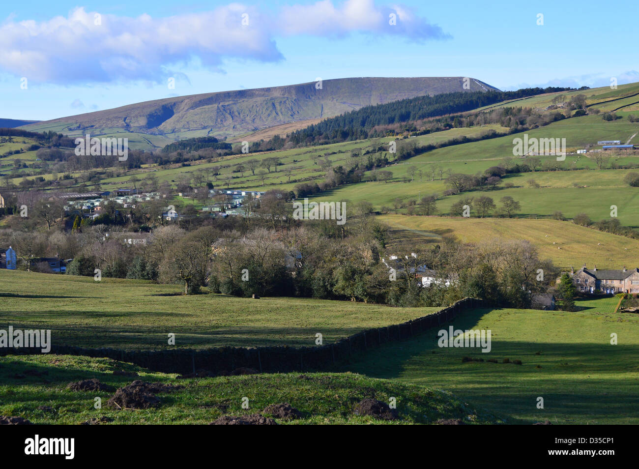 Pendle Hill from the top of Pasture Lane Between Barrowford and Roughlee in winter with a Dry Stone Wall in the foreground. Stock Photo