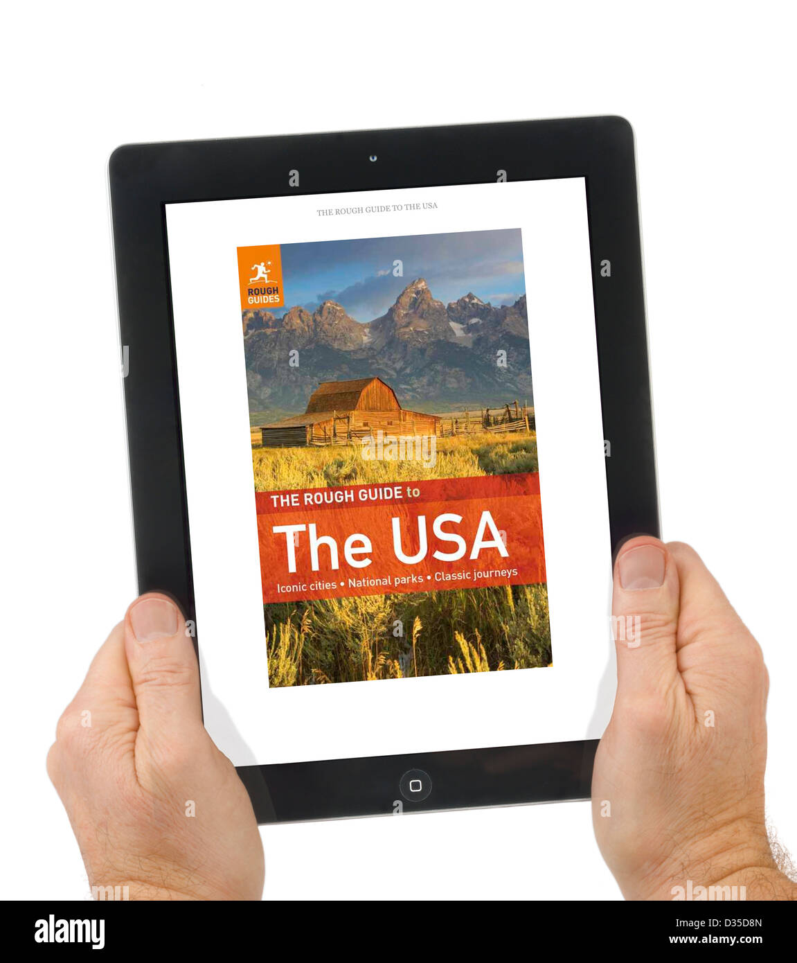 Reading a Rough Guide travel book with the Kindle app on an Apple iPad 4th genration retina display tablet computer Stock Photo