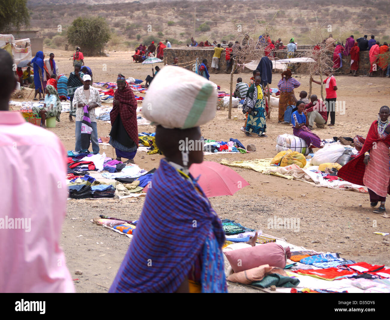 colour colourful people market fabric life africa red blue busy economics  trade color pink clothes busy Tanzania business Stock Photo