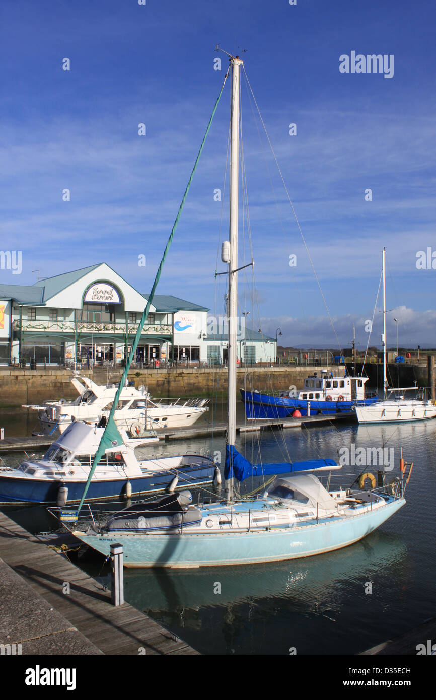 View of yachts and other small boats moored in the marina by Freeport shopping center in Fleetwood, Lancashire, England, U.K. Stock Photo