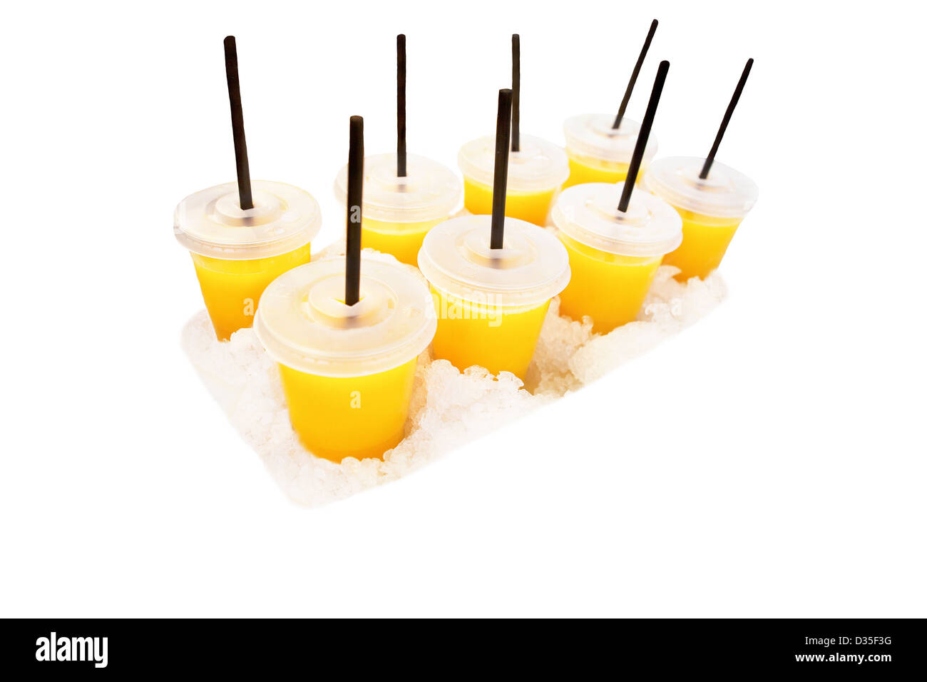 Orange juice cups with sorbets on ice Stock Photo Alamy