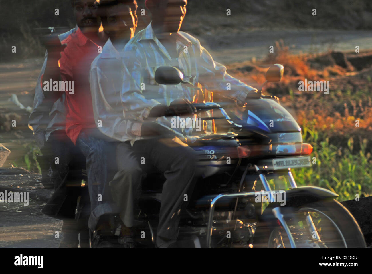 Four men riding on a bike, India Stock Photo