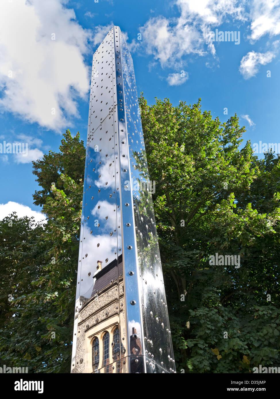 Peter Freeman’s metal tower of light 'Luminous Motion' a contemporary public art sculpture at Winchester Cathedral Hampshire UK Stock Photo