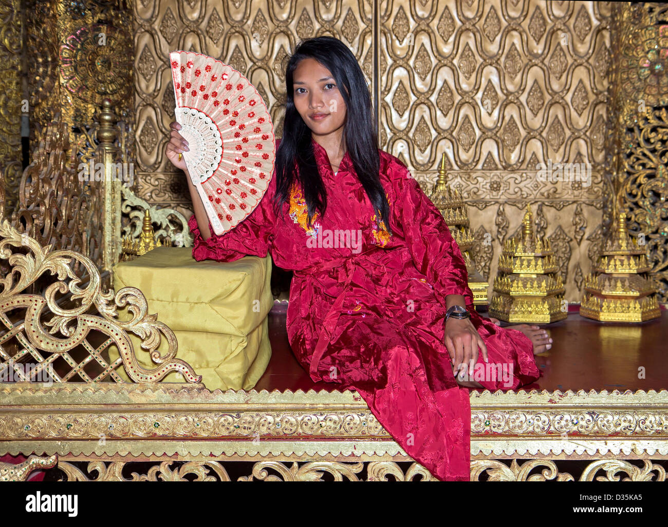 Thai woman sitting in the throne room Stock Photo