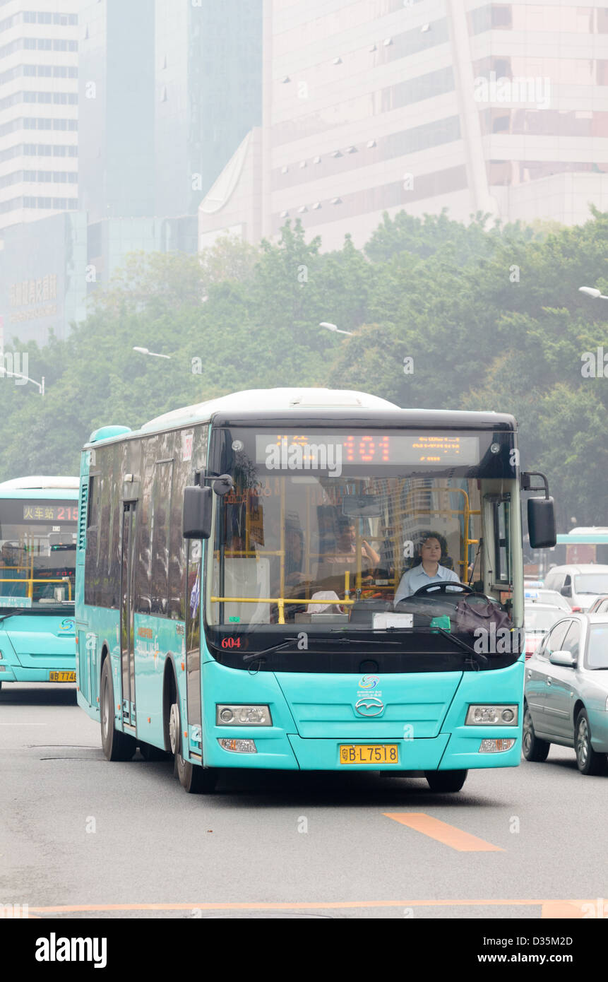 Modern Chinese bus, in service in a major city in China. Urban public transport; heavy traffic; bus service; buses; slow traffic; transportation Stock Photo
