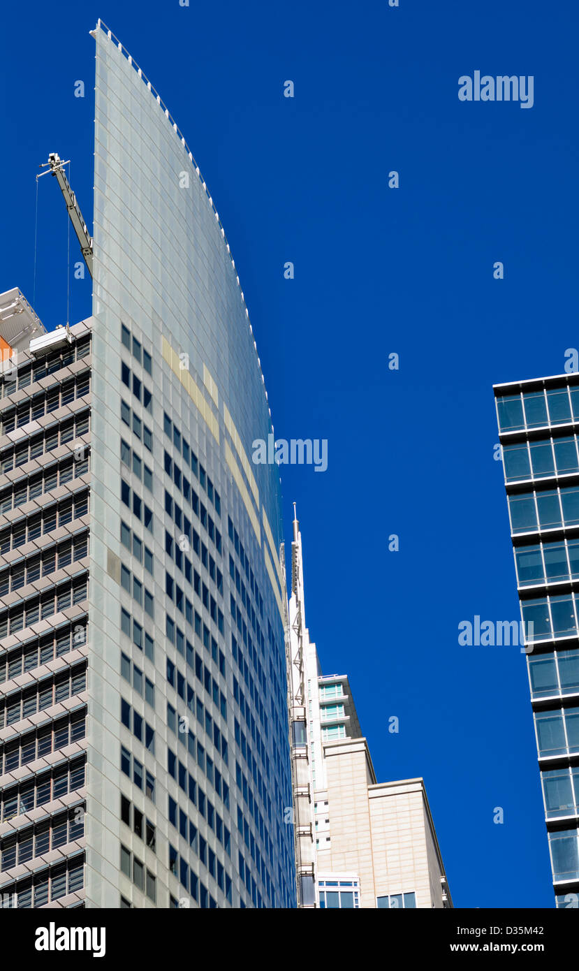 Modern skyscraper architecture; the tops of contemporary buildings with blue sky Stock Photo